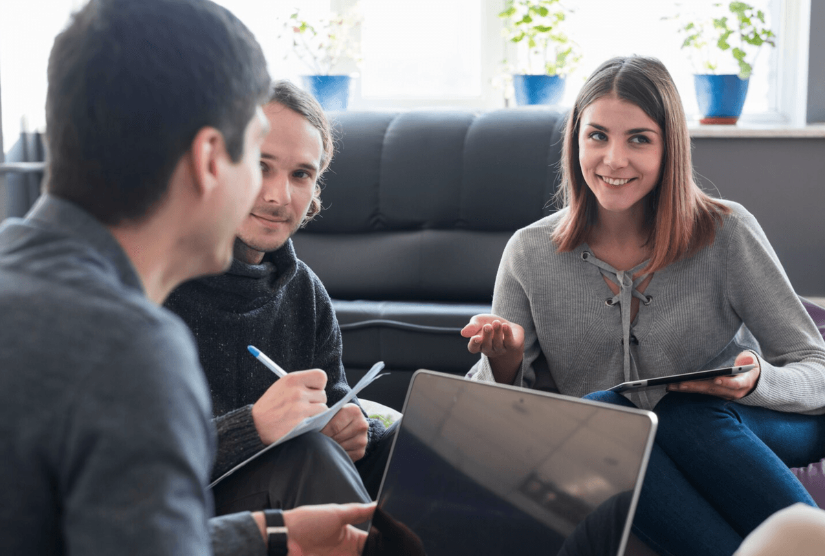 Group discussion with a counselor, showing ongoing support and communication during recovery