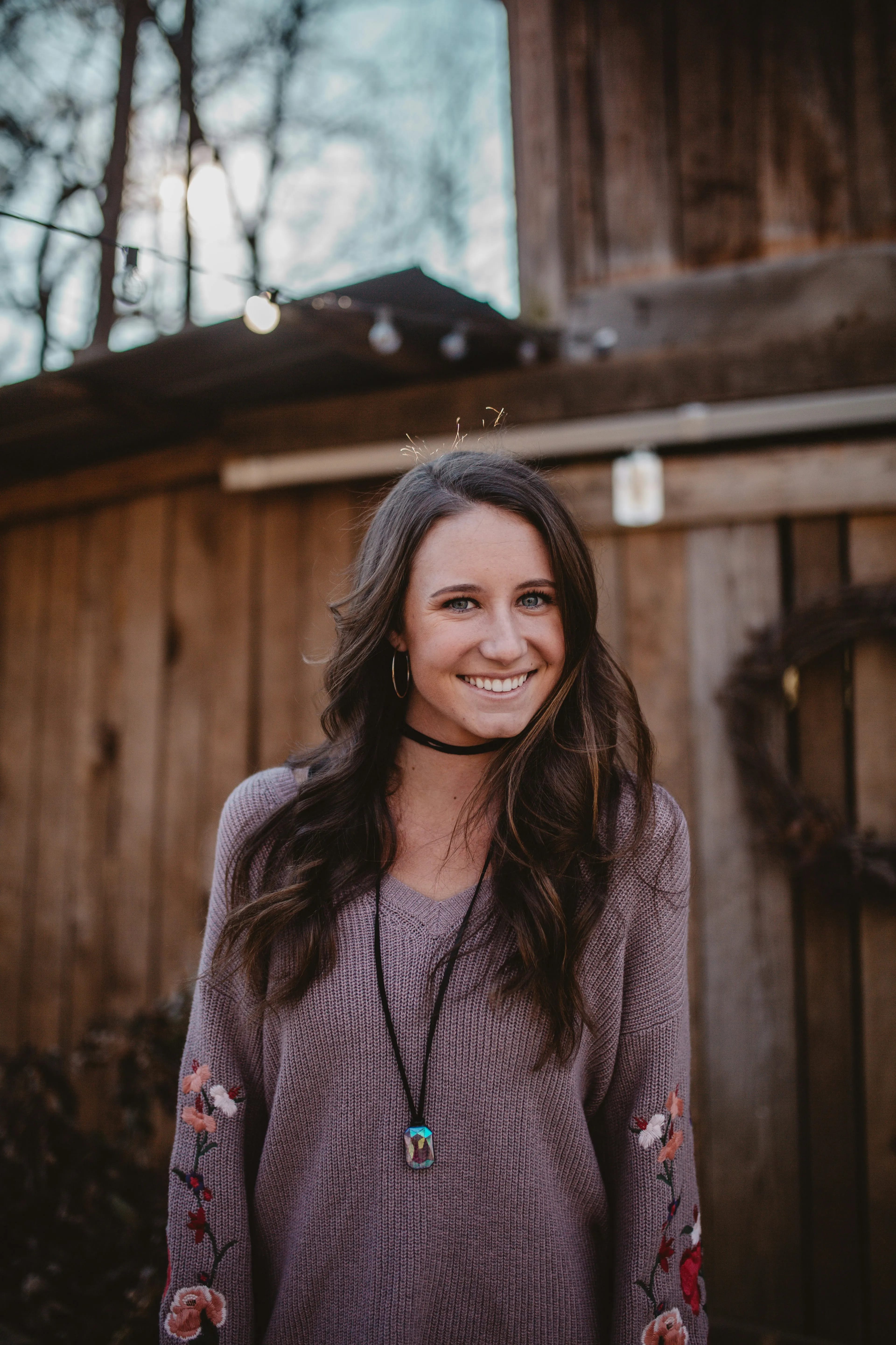 Young woman smiling outdoors, representing hope and recovery from addiction