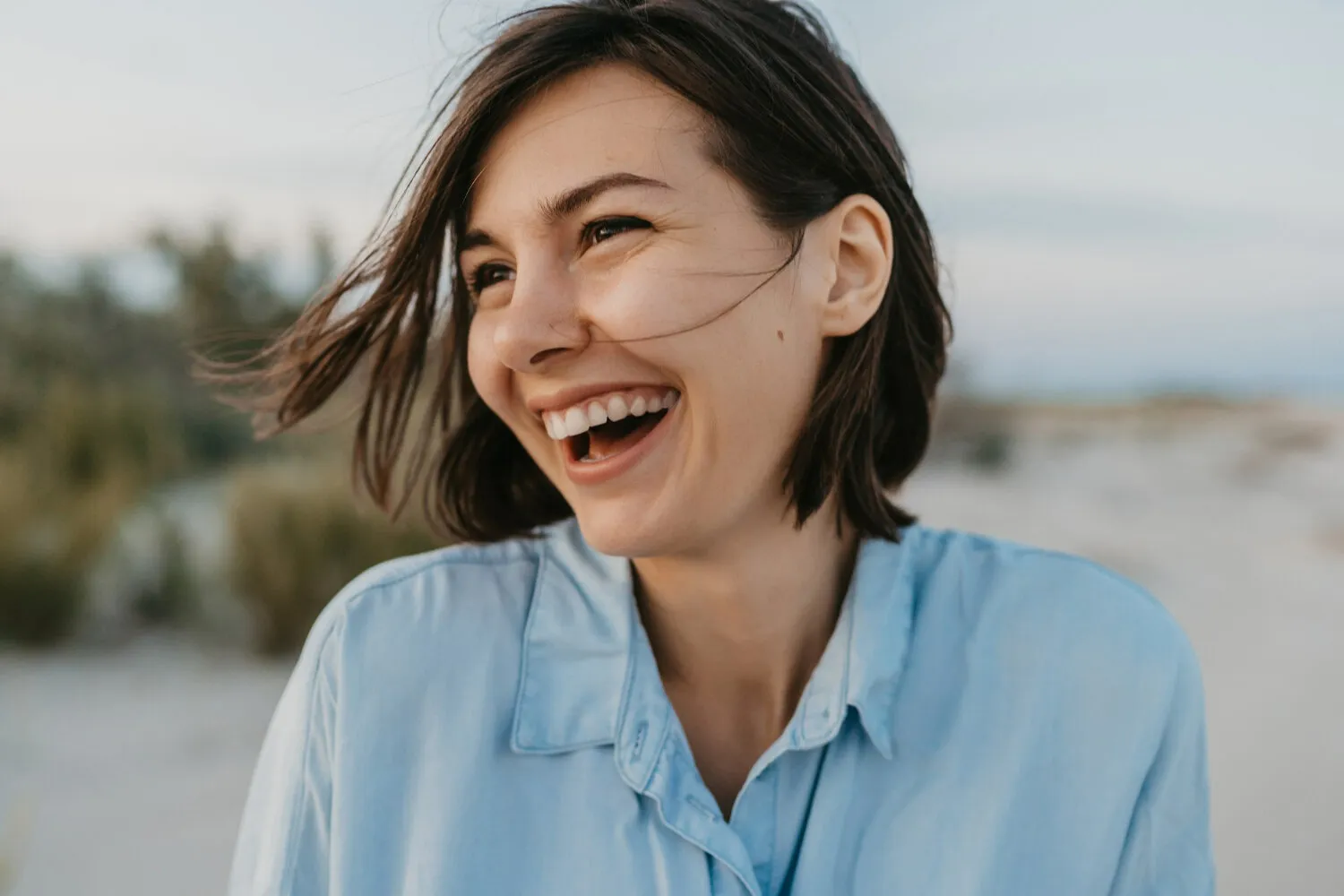 Woman smiling outdoors, representing hope and recovery at Another Chance Rehab