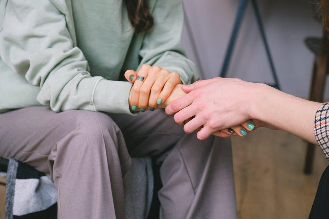 Free Crop psychologist supporting patient during counseling indoors Stock Photo