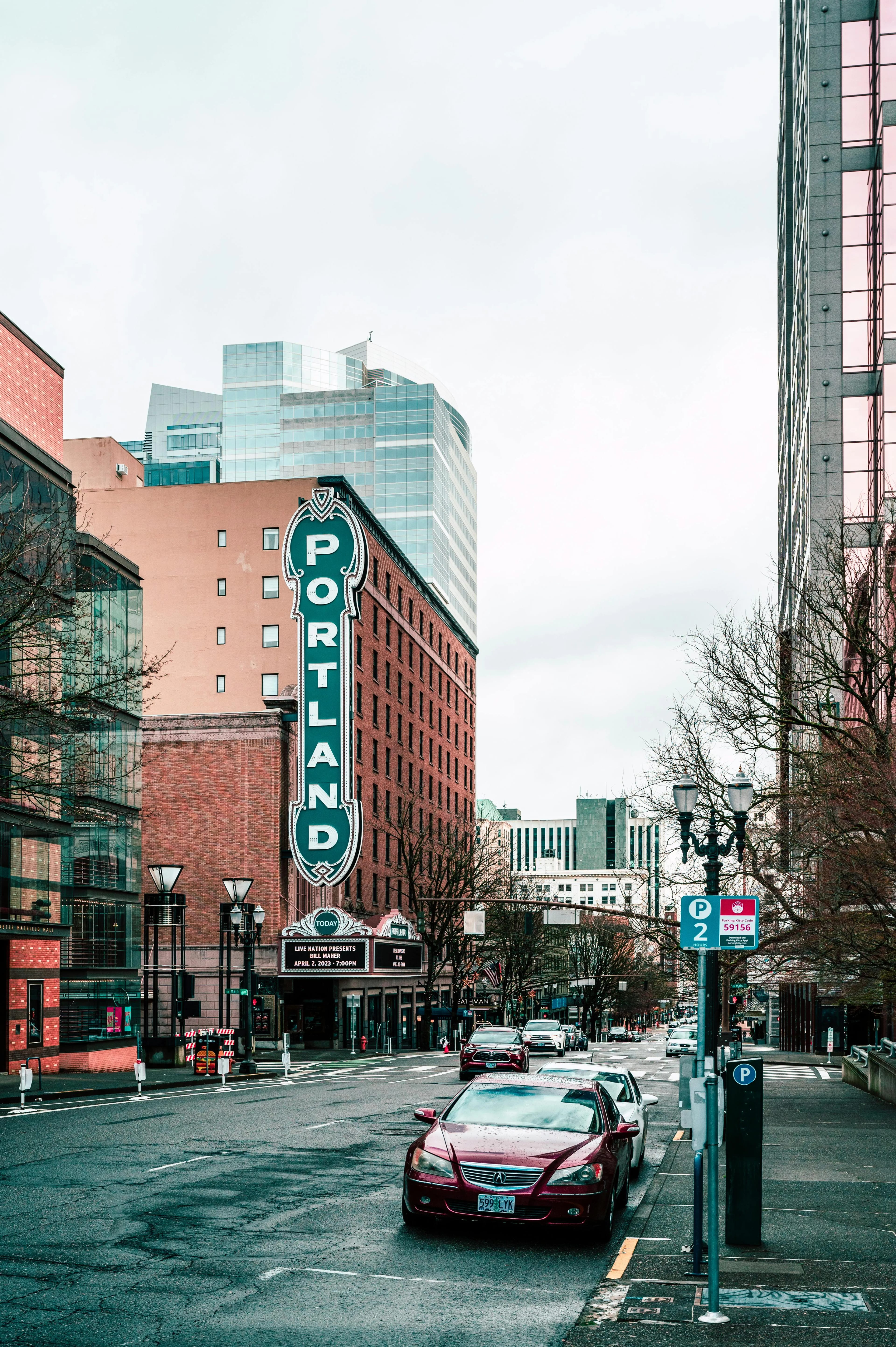 Portland, Oregon city street with iconic Portland sign on brick building downtown